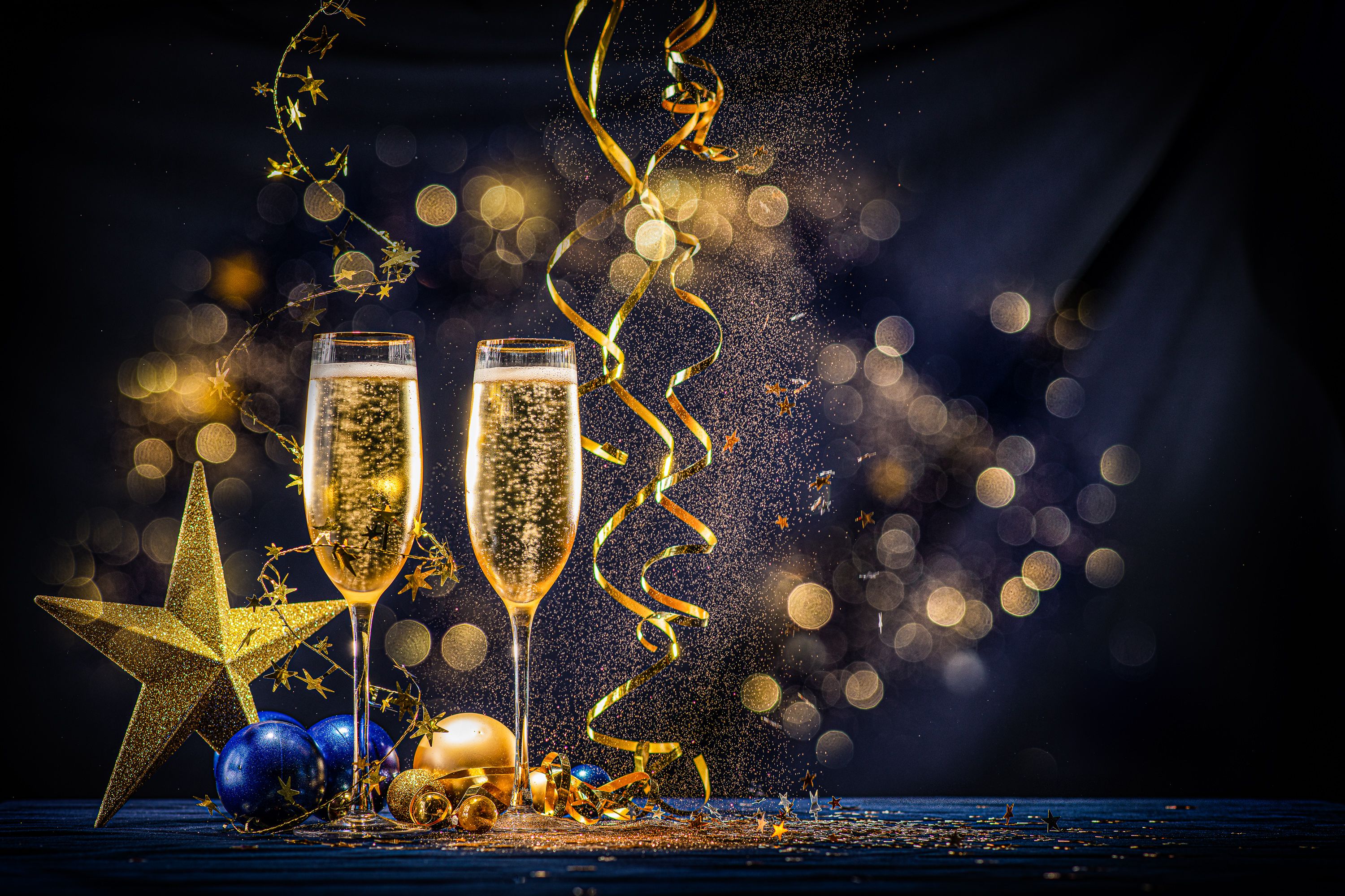 Champagne glasses with Christmas ornaments
