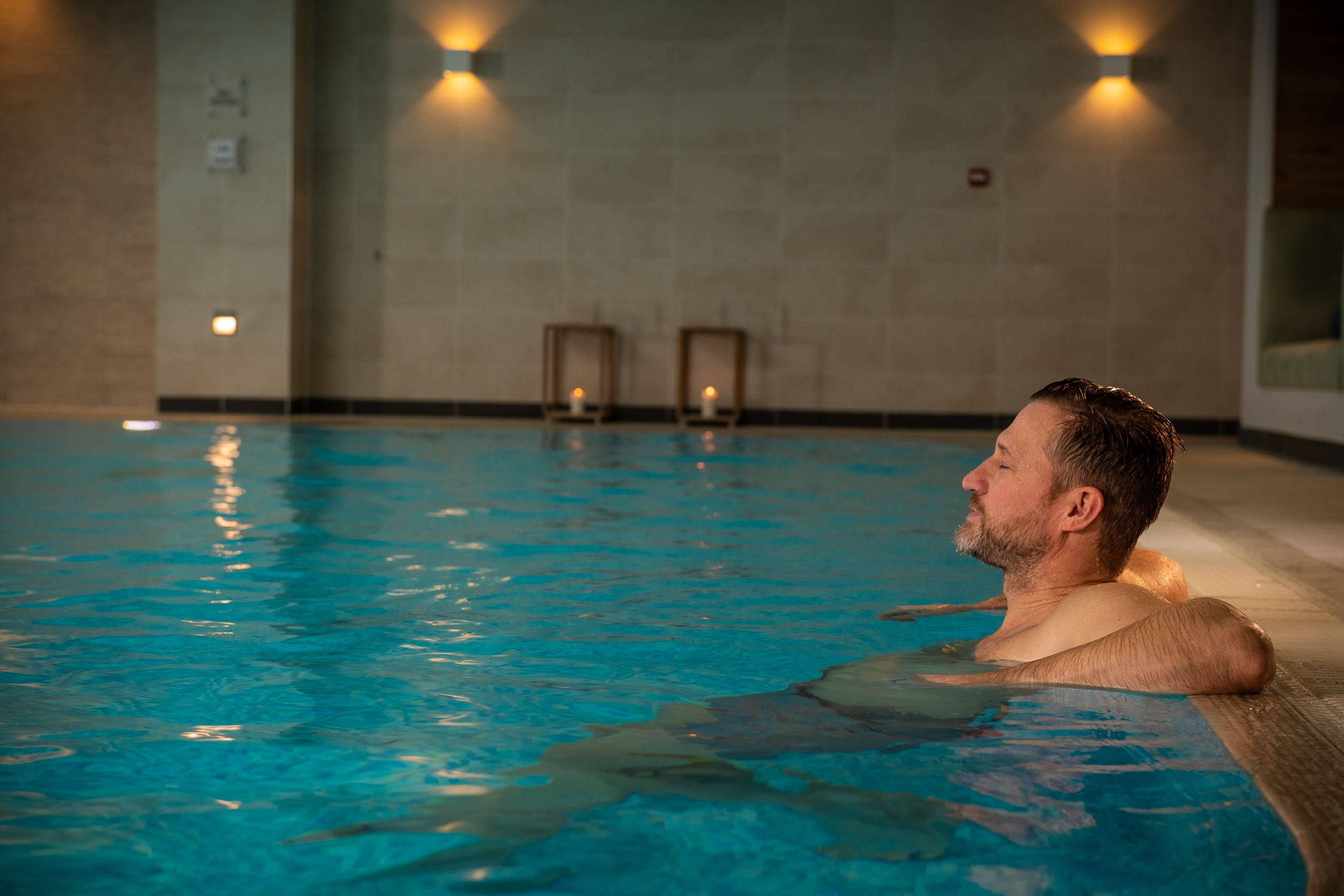Man relaxing in spa pool