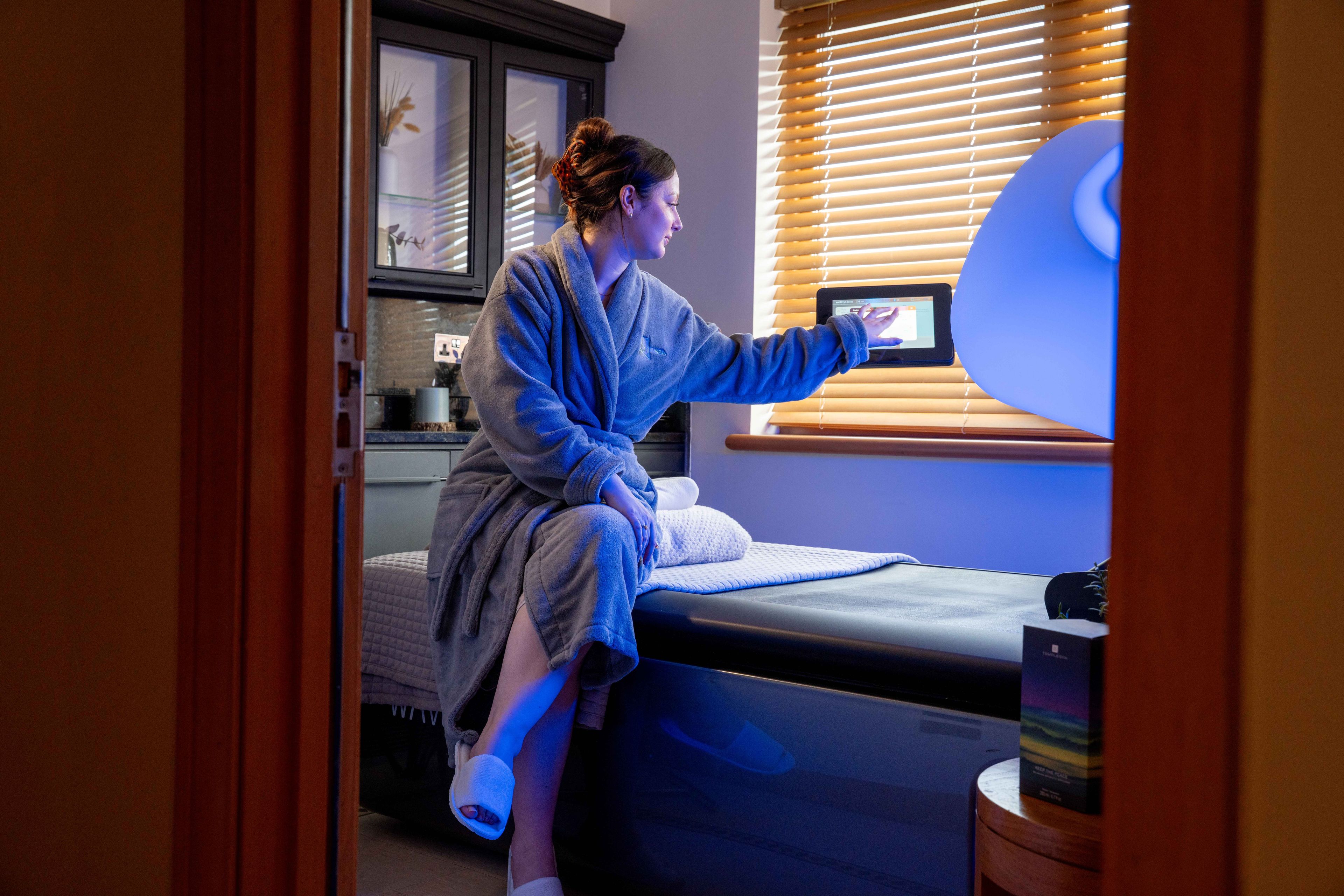 Woman using WaveTouch massage bed
